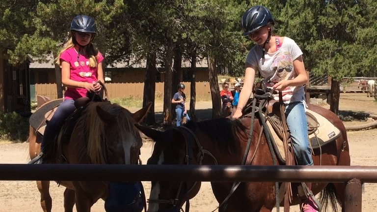 Two girls on horses at Colter Bay in Grand Teton National Park