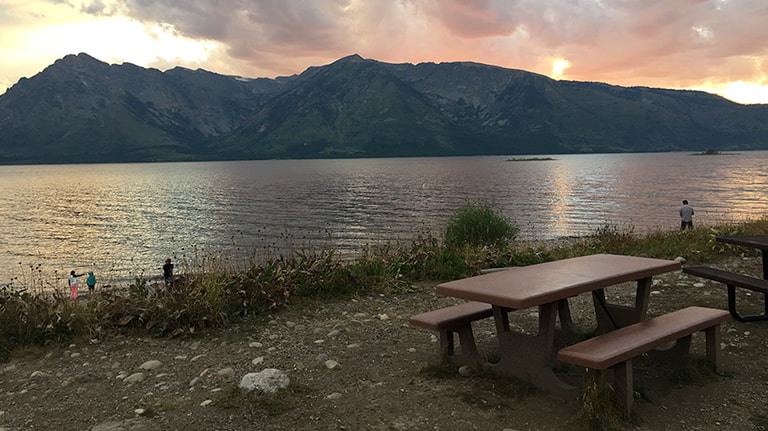 Picnic Table at Lake at Sunset