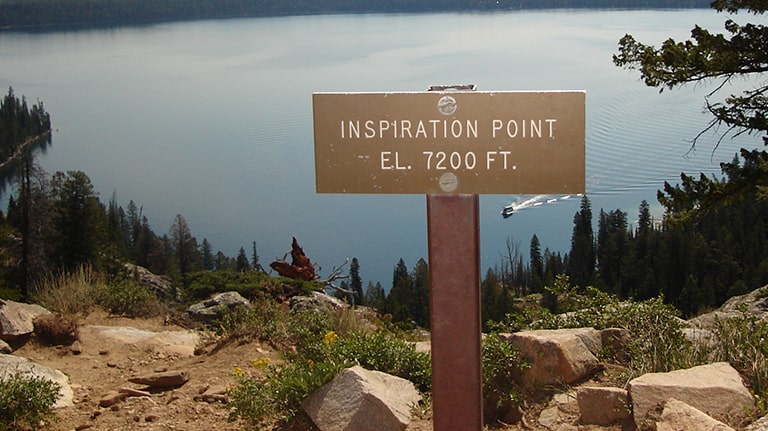 Inspiration Point sign past Hidden Falls overlooking Jenny Lake