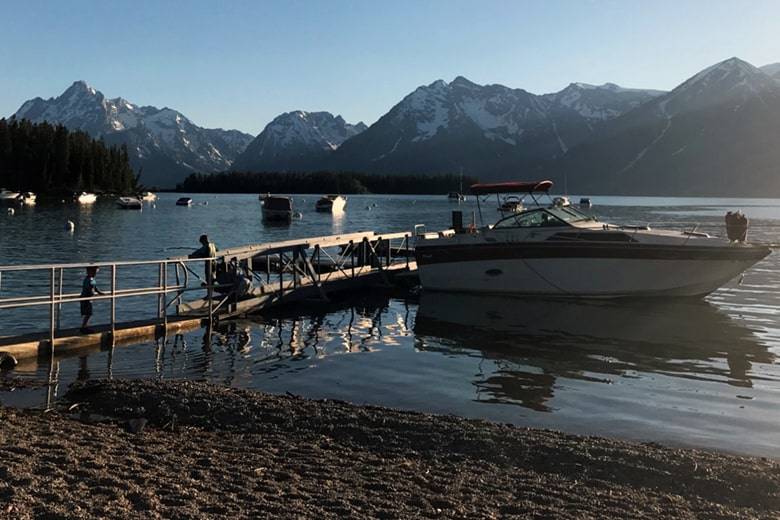 Grand Teton National Park Leek's Marina with boat in foreground and Tetons in background