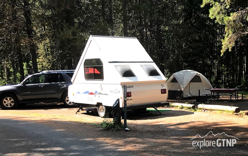 Grand Teton Colter Bay Campground Campsite with an A frame camper and tent