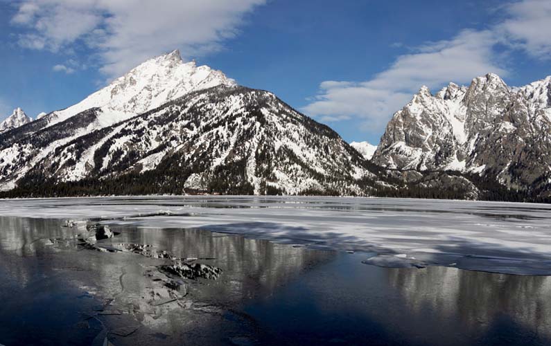 grand teton national park - Jenny Lake with ice and snow on it in early May