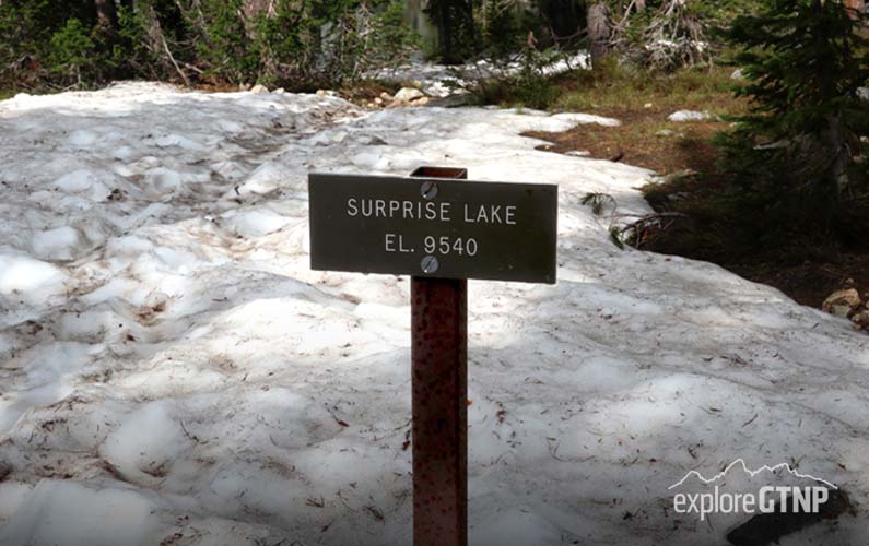 grand-teton-national-park-surprise-lake-sign-with-snow-on-ground