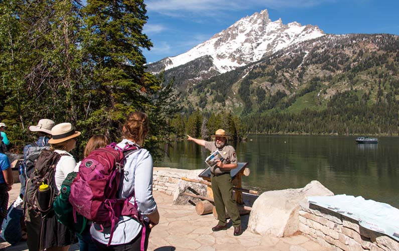 Ranger talking to group of hikers at Jenny Lake at Grand Teton National Park